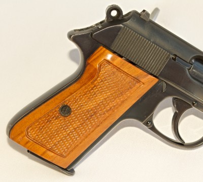 The Walther's trigger is radiused, top strap "anti-glared" and the wood grips are even glass bedded to perfectly fit the frame.