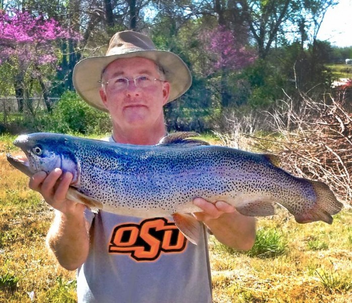 Paul Glover displays his stunning state record trout. Image courtesy Jeremy Bersche/Oklahoma Department of Wildlife Conservation.