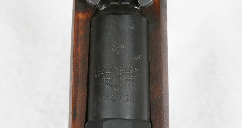 The New England Westinghouse logo on the barrel shank. Centered just above the company name is the Russian Imperial eagle, to the bottom left is the Finnish Army stamp.