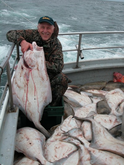 Author with boatload of halibut caught on charter out of Homer.