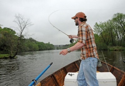 Dave Bakken casts a fly while drift fishing the Chippewa River.