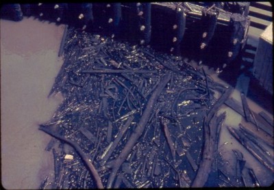 An old slide image showing oil discharge and debris in the Rouge River in the 1960s.