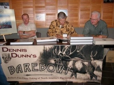 Author and archer Dunn at a book signing event with the father-and-son artist duo of Hayden and Dallen Lambson. The Lambsons created spectacular custom-made art for the book. 