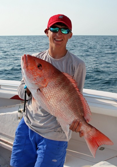 Brandon Jordan of Mobile shows off another big red snapper that have become commonplace for anglers off the Alabama Gulf Coast.
