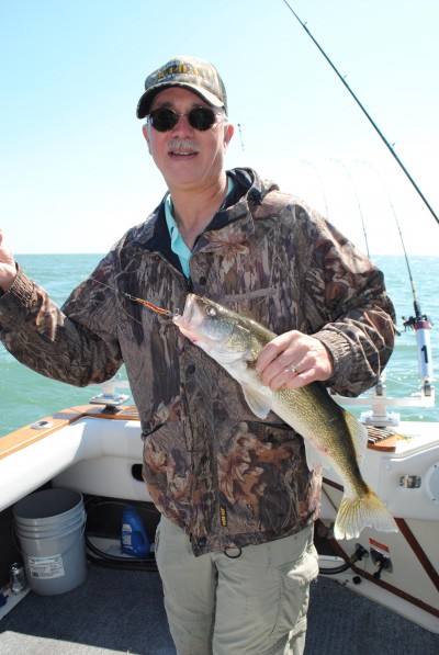 DNR wildlife biologist Mark Sargent shows off a Lake Erie walleye. 
