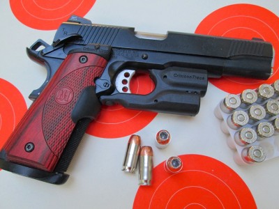 This is one swell setup. Crimson Trace Master Series Lasergrips and the Crimson Trace Lightguard for 1911s.