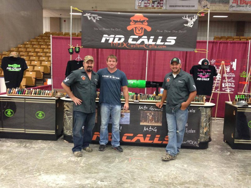 Standing in front of the duck call from left to right are Mark Hillery, UFC veteran Matt Hughes and Damen Hillery.