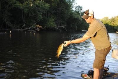 Scott Markham tosses back a Kalamazoo River smallmouth.