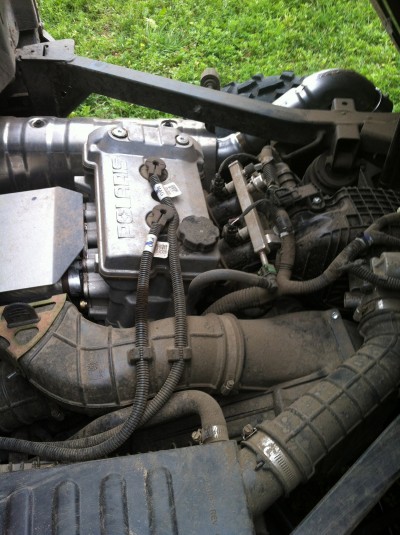 Accessing the engine is a snap on the Ranger. You give the lever a tug and lift the dump box up and it's right there. 