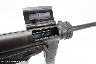 The M3 fires from an open bolt. This means a big hunk of metal has a firing pin welded to it. It's held back with pressure from an even bigger spring. Pulling the trigger releases the bolt, which strips a round from the magazine, shoves it in the barrel, and discharges it.
