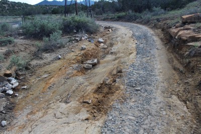 A section of washed-out road prior to repair.