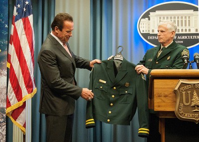 Arnold Schwarzenegger is presented with an honorary U.S. Forest Service Jacket by Chief Tom Tidwell.