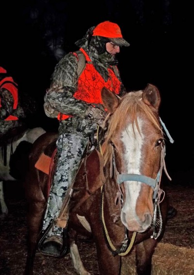 The author prepares to ride into the Duck Mountain Provincial Forest atop Red, a horse owned by Bows ‘N Bullets Outfitters.