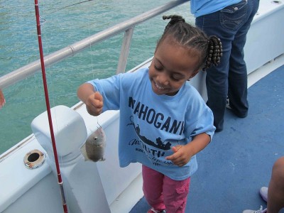 Youngest angler shows off her catch