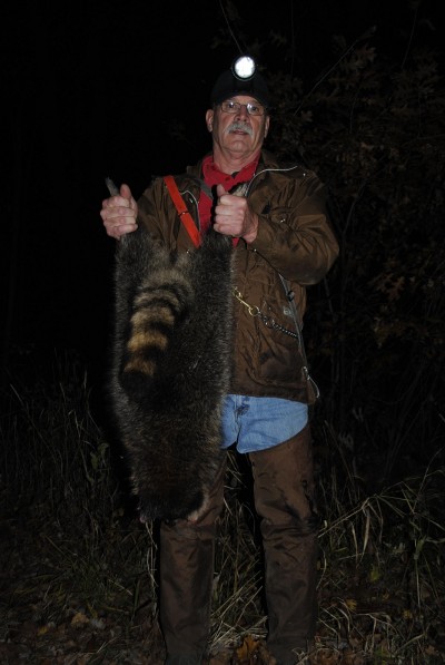 Jim Zimmerman shows off a raccoon.