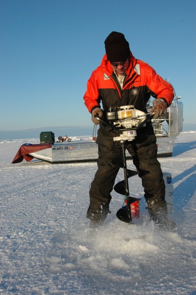 Augers are needed to get through the ice and to the fish; power augers make the job easier when the ice is thick.