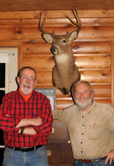Tom Heberlein, left, and Ben Niemann, share the story of “Schleppus,” a buck Niemann killed in 1982.