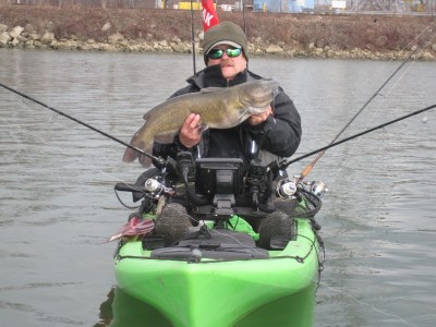 This Michigan kayak angler knows the blue cats continue feeding through the coldest winter months. Image by Lucian Gizel.