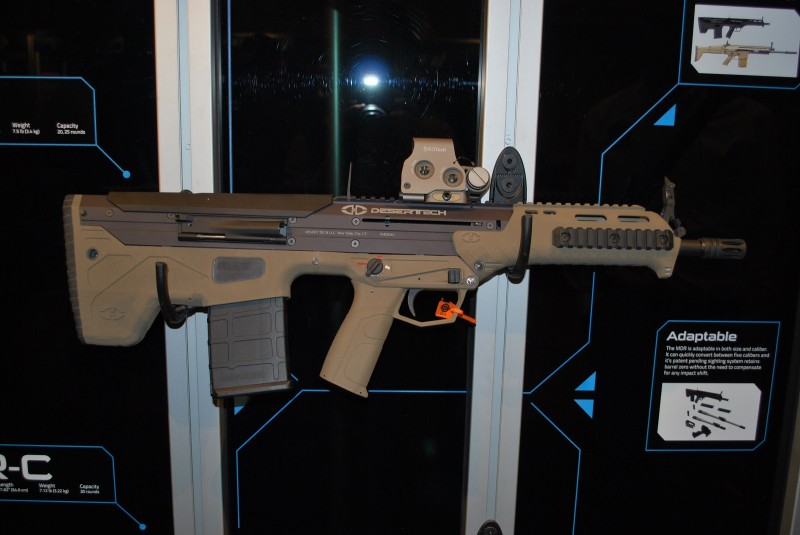 A .308 MDR with FDE furniture and an EOTech on the top rail. The backup iron sights are also deployed.