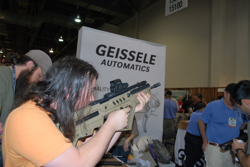A SHOT Show attendee tests the Geissele Tavor trigger.