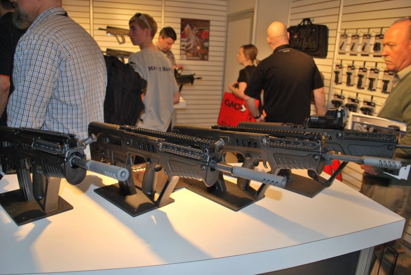 A line of "ban-compliant" Tavors at the IWI US SHOT Show booth.