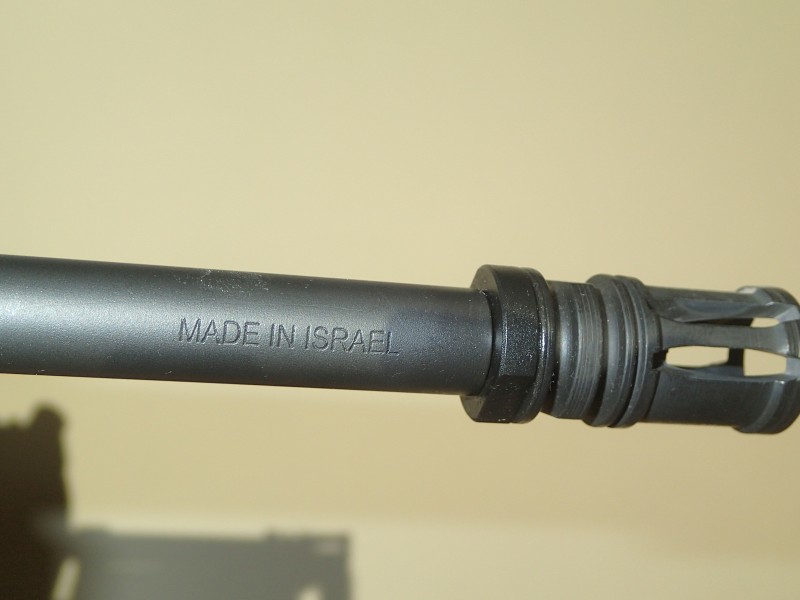 A mark of quality on the Tavor's barrel.