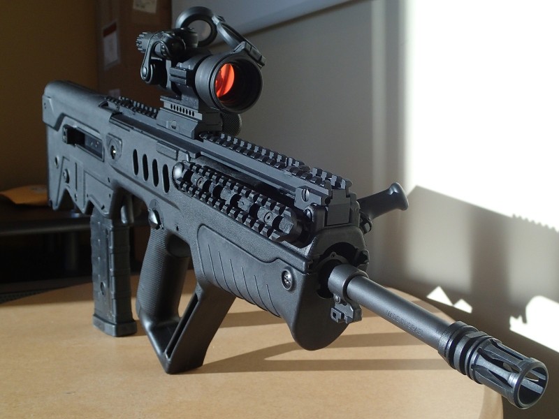 The author's Tavor SAR TSB18 with an Aimpoint PRO red dot sight.