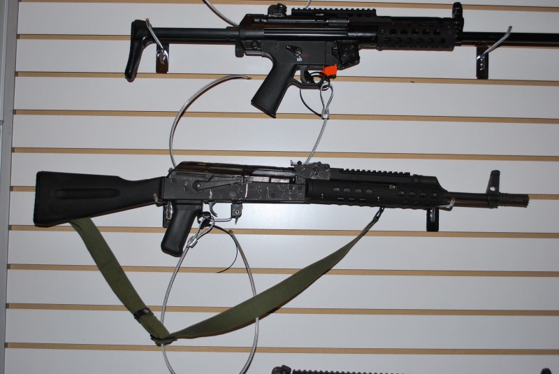 An AK on display at the Troy booth outfitted with the railed gas block and short handguard.