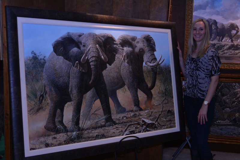 Maxine Bone with her painting of elephants about to charge.
