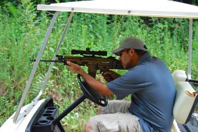 Here's some practical advice: Always keep one hand on the wheel while shooting a tactical rifle from a golf cart.