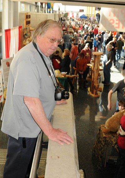 Glenn Helgeland watches the crowd pour into the 2014 Deer & Turkey Expo on April 5 in Madison. This year’s show attracted 24,300 hunters and their families.