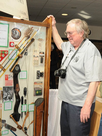 Glenn Helgeland looks at a display from Wisconsin’s Bowhunting Hall of Fame, which is run by the Wisconsin Bowhunting Heritage Foundation.