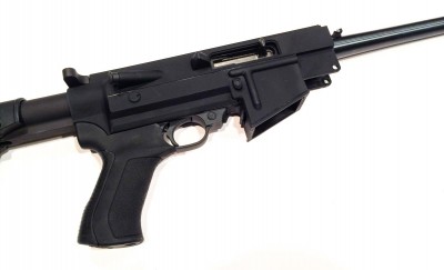The receiver housing serves as the mounting point for pistol grip and adjustable stock.