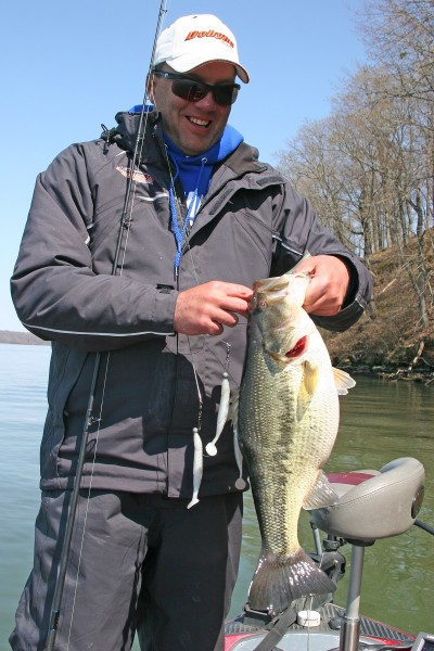Brent Crow unhooks a fat largemouth from an Alabama rig on sister lake, Wilson Reservoir. 