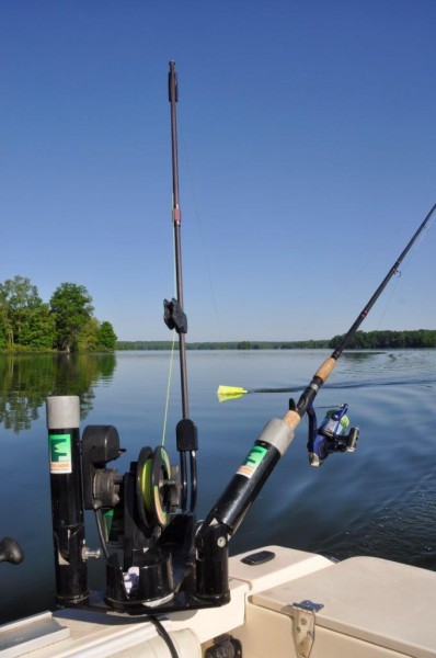 Muskie angler Paul Anderson gets double duty out of his downriggers by using them as powered planerboard masts.