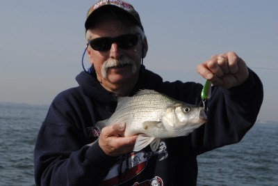 John Cleveland shows off a white bass taken on a spoon.