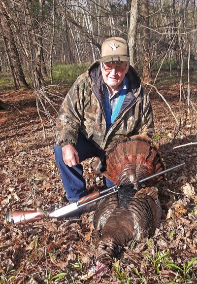 Milton Collins, 86, of Green Bay holds his first wild turkey, which he shot May 14 in northern Brown County while hunting with his son-in-law, Gregg Maes of Suamico.
