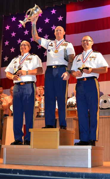Staff Sgt. Patrick Franks (center) with the National Championship Harrison Trophy along with Service Pistol teammates Sgt. 1st Class James Henderson and Sgt. Greg Markowski stand atop the winners podium at the NRA National Championship Award Ceremony. This may be the first time in history where all three of the top positions went to the USAMU.