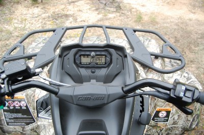 Engaging the Visco-Loc differential is as simple as flipping a rocker switch on the right grip. The digital display is easy to read and the rider is positioned to easily see over the front end at trail obstacles. Image by Derrek Sigler.
