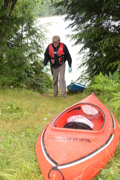 Larry Keen prepares his kayaks to go fishing in Iron County.