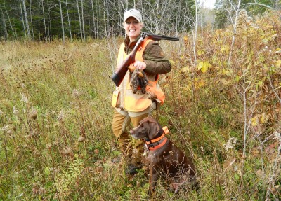 The author, her dog Wesson, and a woodcock. Starr always makes sure to check Wesson for any injuries, regardless of how minor they may be, after a hunt.
