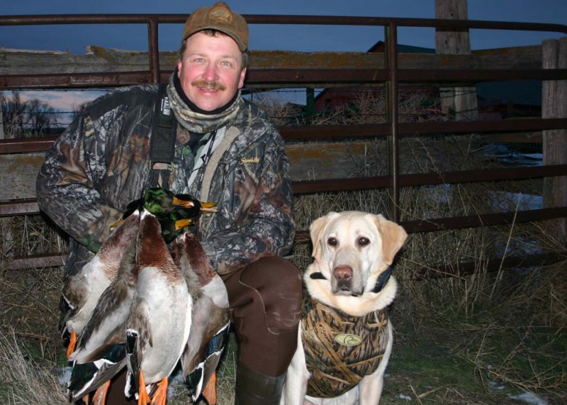 Bill Miller, pictured here with his bird dog Huck, admittedly gets a little Cliff Clavin-like in his obsession for duck identification. Image courtesy Bill Miller.