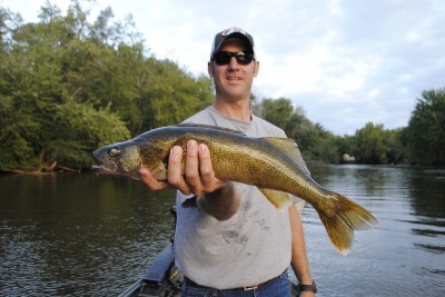 Scott Markham shows off a walleye -- a bonus for bass anglers on the Kalamazoo River.
