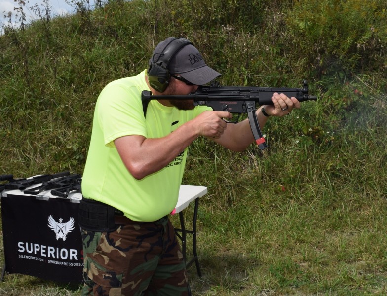 A shooter fires a Dakota Tactical D54P mated with a select-fire trigger mechanism and housing.