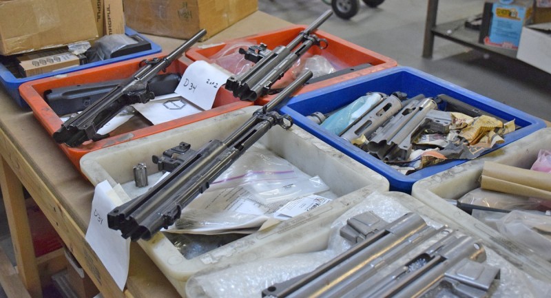 Various parts awaiting assembly into complete firearms at Dakota Tactical's workshop in Canton, Michigan.