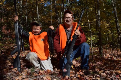 Air rifles, like the one the author's son is holding on the left, are great for kids to learn on. They don't have significant recoil like traditional firearms.