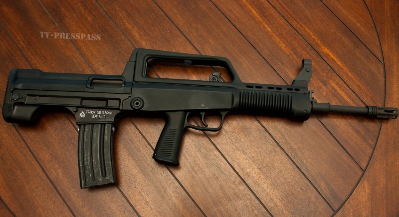 The Norinco T97. This affordable bullpup is chambered in .223 and accepts standard AR-15 mags.