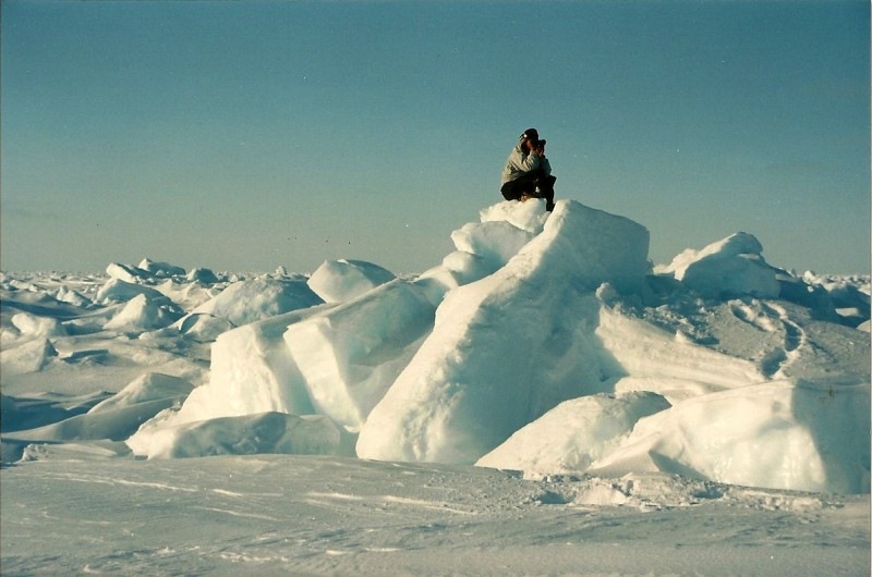 Eric Oogark searching for polar bear while atop an icy terrain feature. Image courtesy Dennis Dunn.