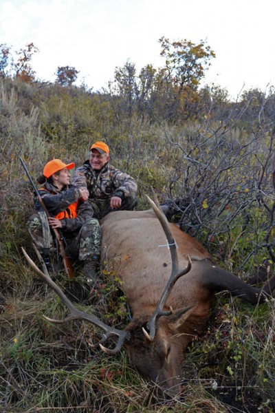 Patrick Durkin congratulates his daughter Leah on her first bull elk.