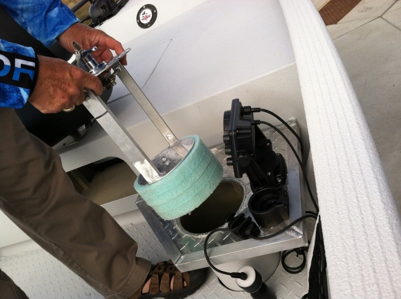 One of the eight-inch plugs being removed from a hole in the Holey Boat. Image by Kristine Houtman.